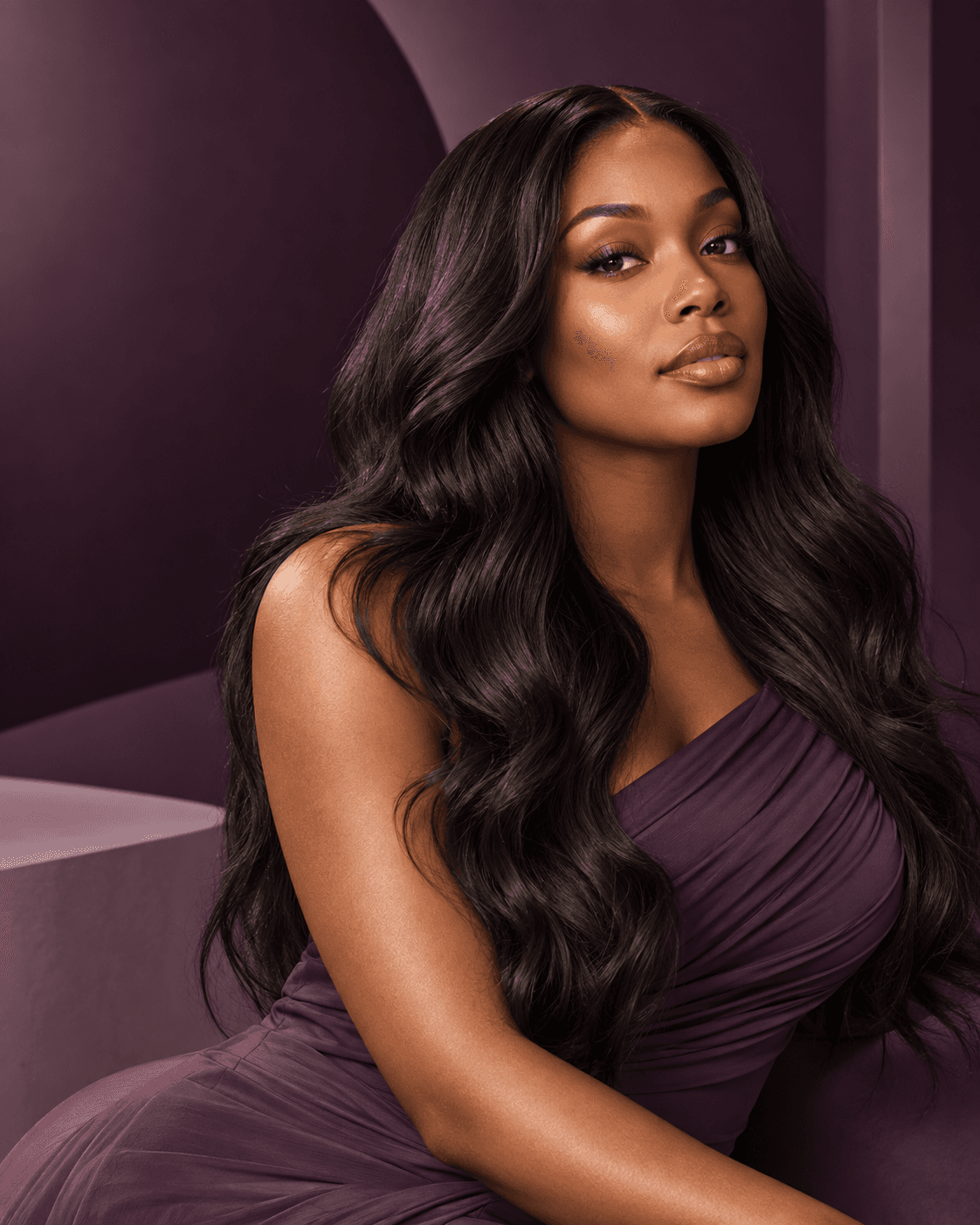 Model wearing long, dark body-wave hair